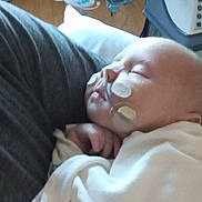 Ivy joined the competition — help win amazing prizes! baby, sleeping, blanket, medical_tubes, hospital, patient, infant, person, healthcare, resting, face, hand, white_clothing, closeup, care, indoor, young_child, medical_equipment, comfort, peaceful