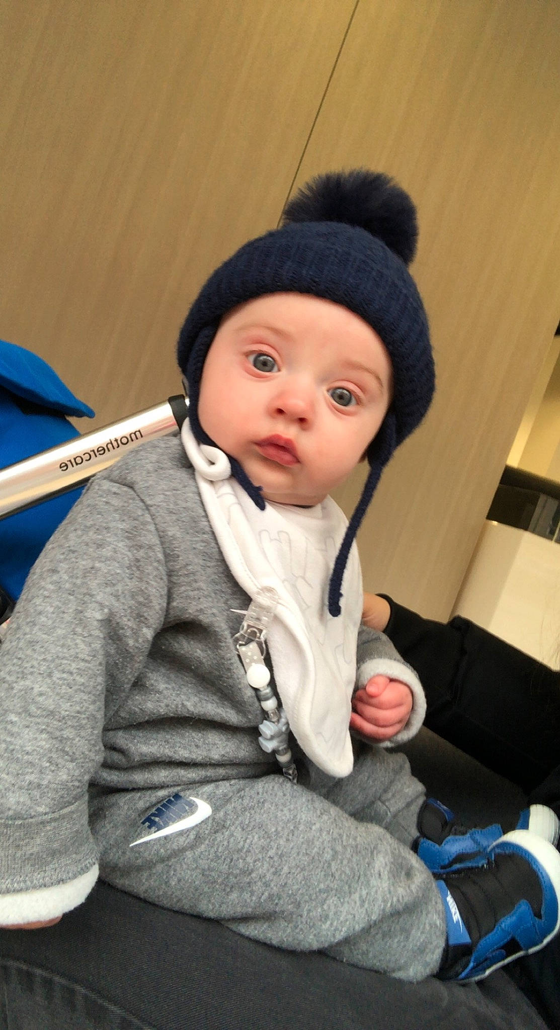 Kodi joined the competition — help win amazing prizes! baby, beanie, blue, cap, cheek, child, comfort, electric_blue, fun, headwear, human_body, jacket, knit_cap, outerwear, person, sitting, skin, sleeve, standing, toddler