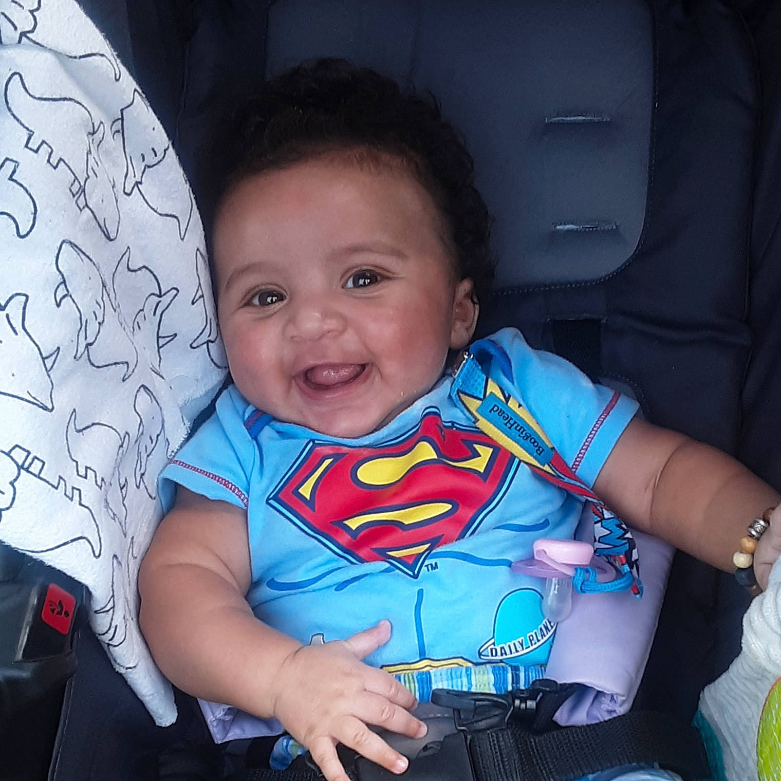 Jamison is registered to the contest to win money with this photo: arm, azure, baby_toddler_clothing, blue, cheek, cool, eye, face, facial_expression, finger, hairstyle, hand, happy, head, human_body, iris, mouth, person, skin, sleeve