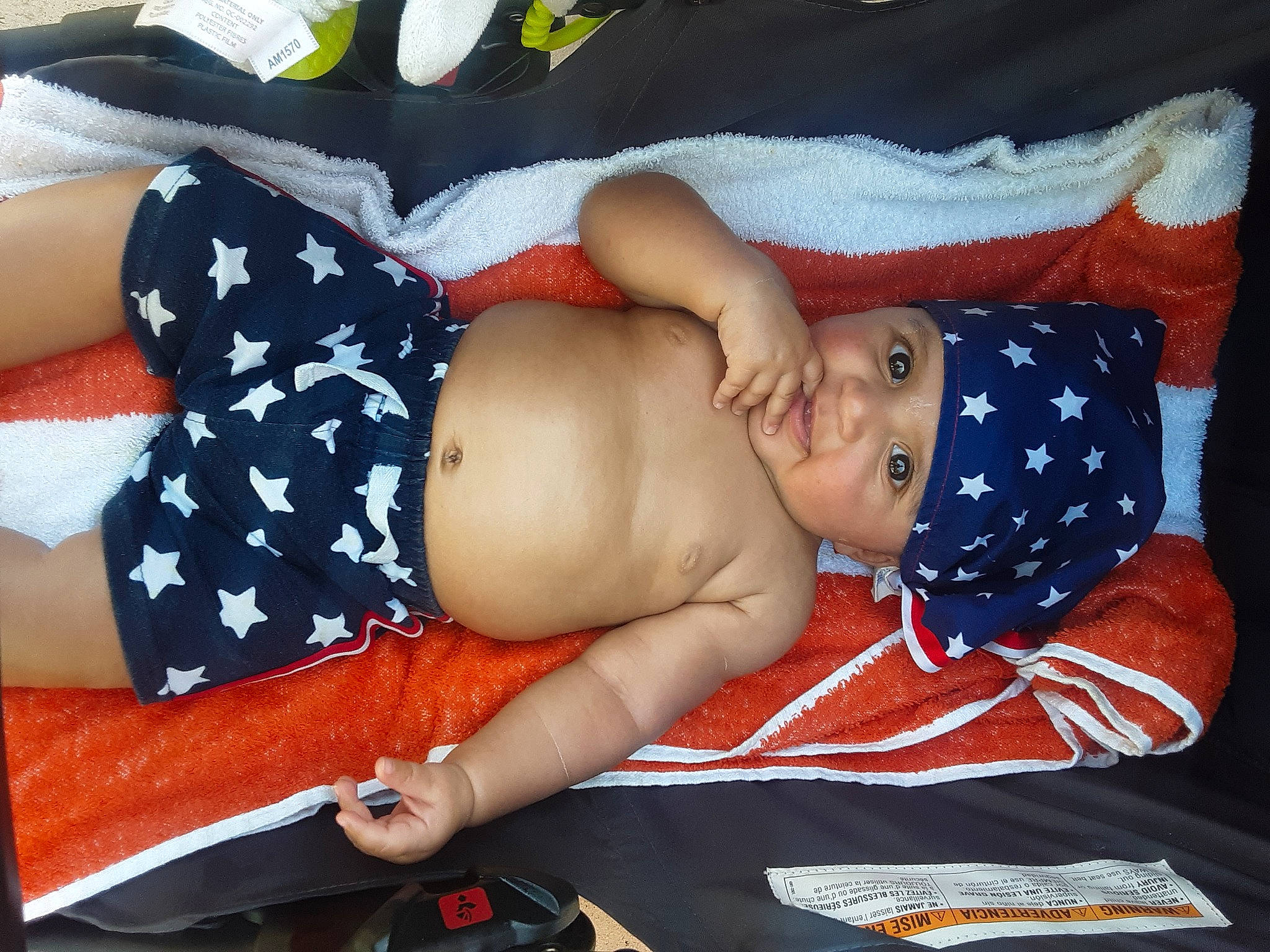 Jamison is registered to the contest to win money with this photo: abdomen, baby, baby_sleeping, baby_toddler_clothing, chest, child, comfort, elbow, headgear, headwear, human_body, human_leg, knee, lap, leg, pattern, person, stomach, textile, thigh