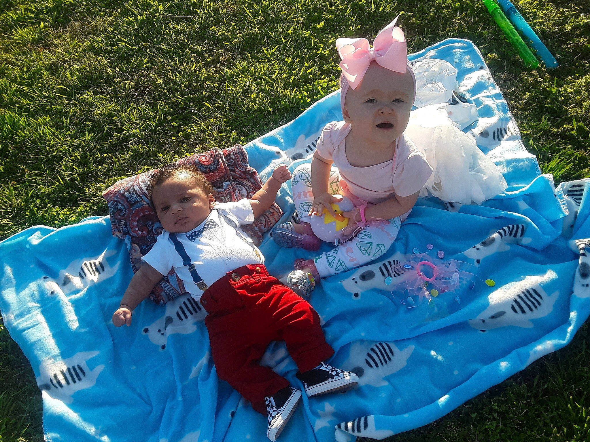 Jamison is registered to the contest to win money with this photo: baby, baby_products, camping, child, event, fun, games, grass, green, happy, headwear, lawn, leisure, outdoor_recreation, people_in_nature, person, recreation, shorts, sitting, smile