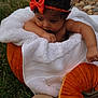 baby, infant, pumpkin, orange_bow, white_towel, grass, outdoor, curly_hair, cute, two_months, headband, fall, seasonal, child, portrait, nature, holiday, autumn, skin, baby_pose