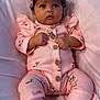 Layla joined the competition — help win amazing prizes! baby, infant, pink_outfit, headband, curly_hair, lying_down, soft_texture, cute, adorable, floral_pattern, cozy, child, small_hands, tiny_feet, socks, portrait, indoor, closeup, looking_up, peaceful