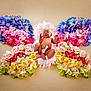 artistic, baby, butterfly_shape, colorful_flowers, creative_photography, cute, delicate, floral_art, flower_arrangement, headband, infant, nature_inspired, newborn, pastel_colors, peaceful, pink_feathers, portrait, skin, sleeping_baby, soft_texture