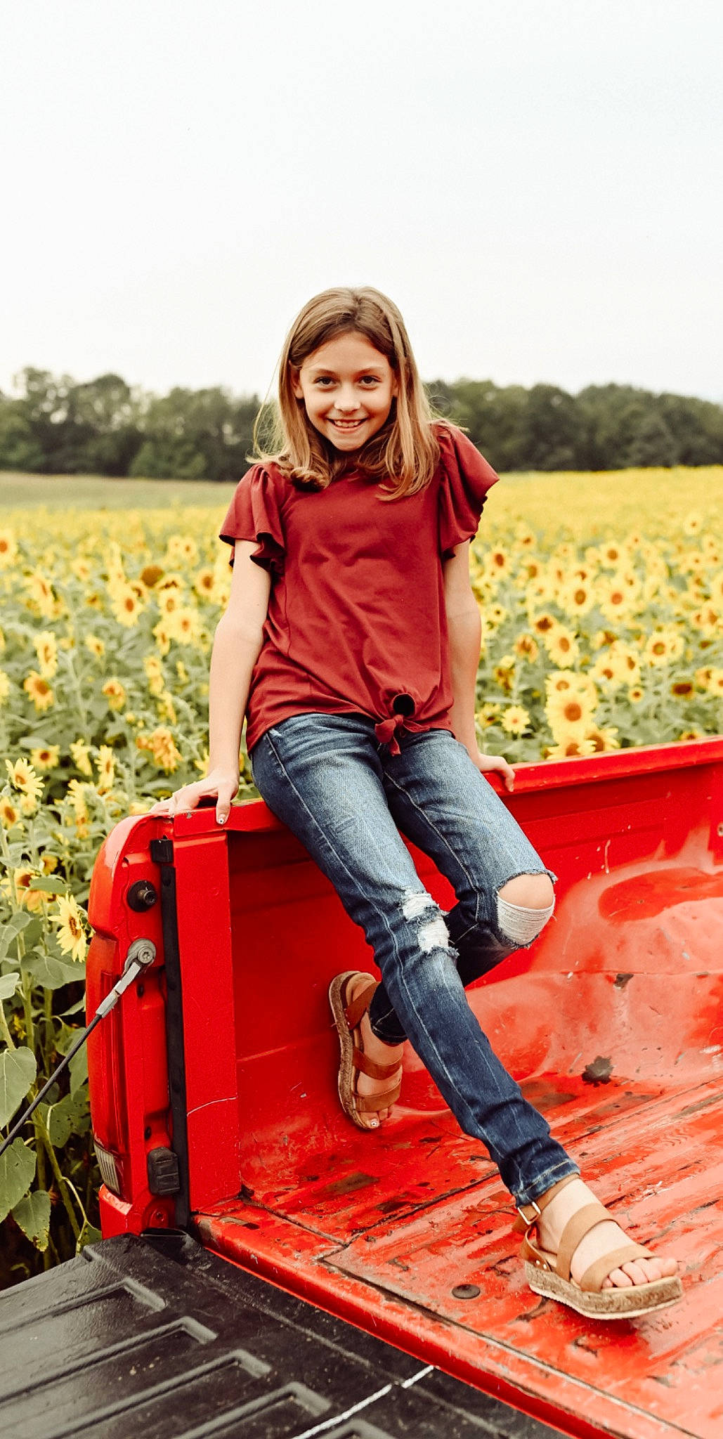 Leigha is registered to the contest to win money with this photo: denim, flash_photography, flower, fun, grass, grassland, hair, happy, joy, landscape, leaf, leisure, orange, people_in_nature, person, plant, sky, smile, standing, summer