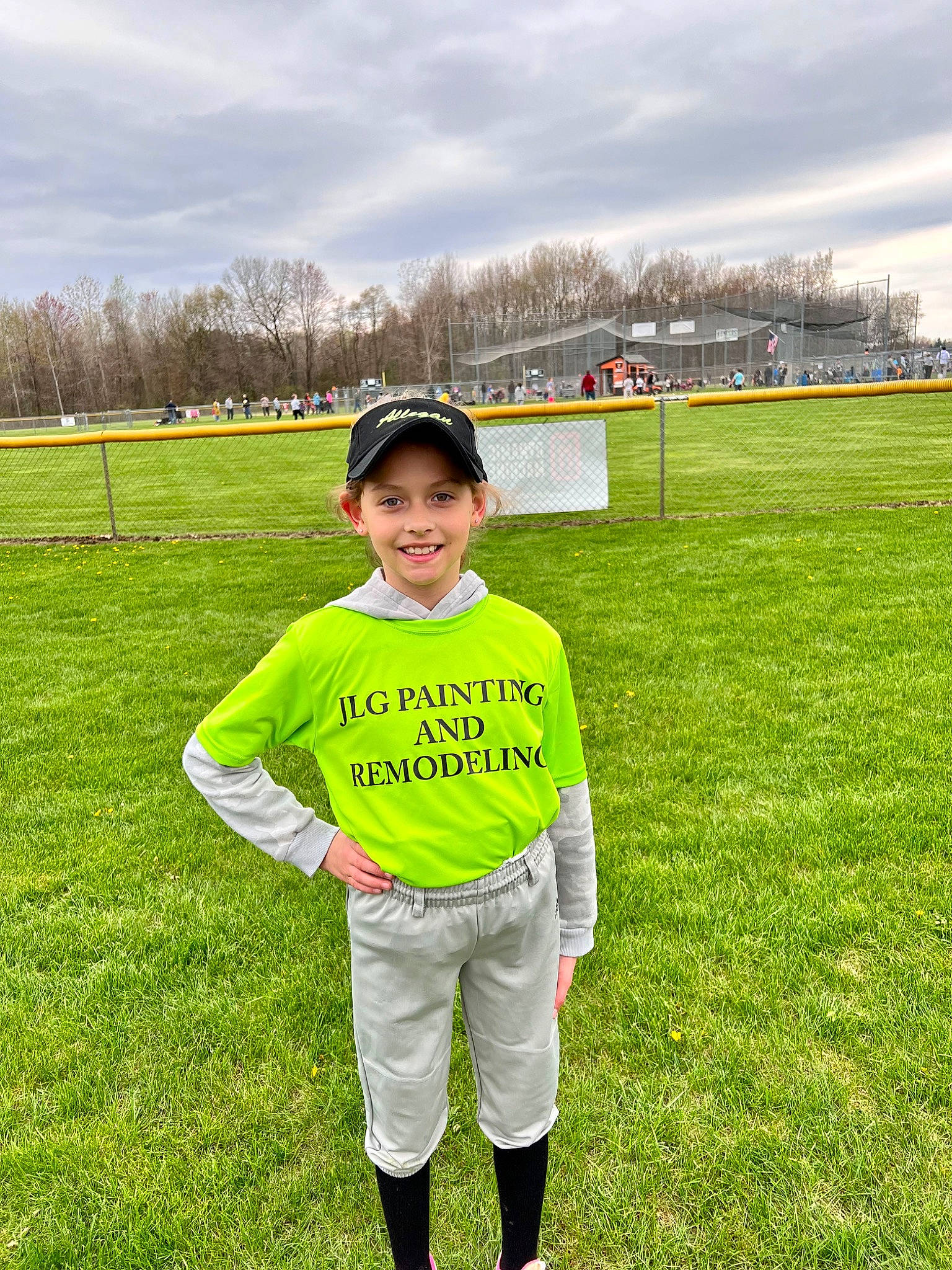 Leigha is registered to the contest to win money with this photo: cloud, competition_event, grass, grassland, happy, hat, headwear, jersey, joy, lawn, leisure, meadow, people_in_nature, person, plain, player, recreation, sky, sleeve, smile