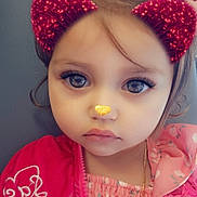 Mia is registered to the contest to win money with this photo: child, girl, toddler, portrait, close_up, face, wide_eyes, serious_expression, pink_jacket, floral_clothing, sparkly_filter, cat_ears, nose_filter, bokeh, digital_effect, indoors, seated, hair, necklace, photography