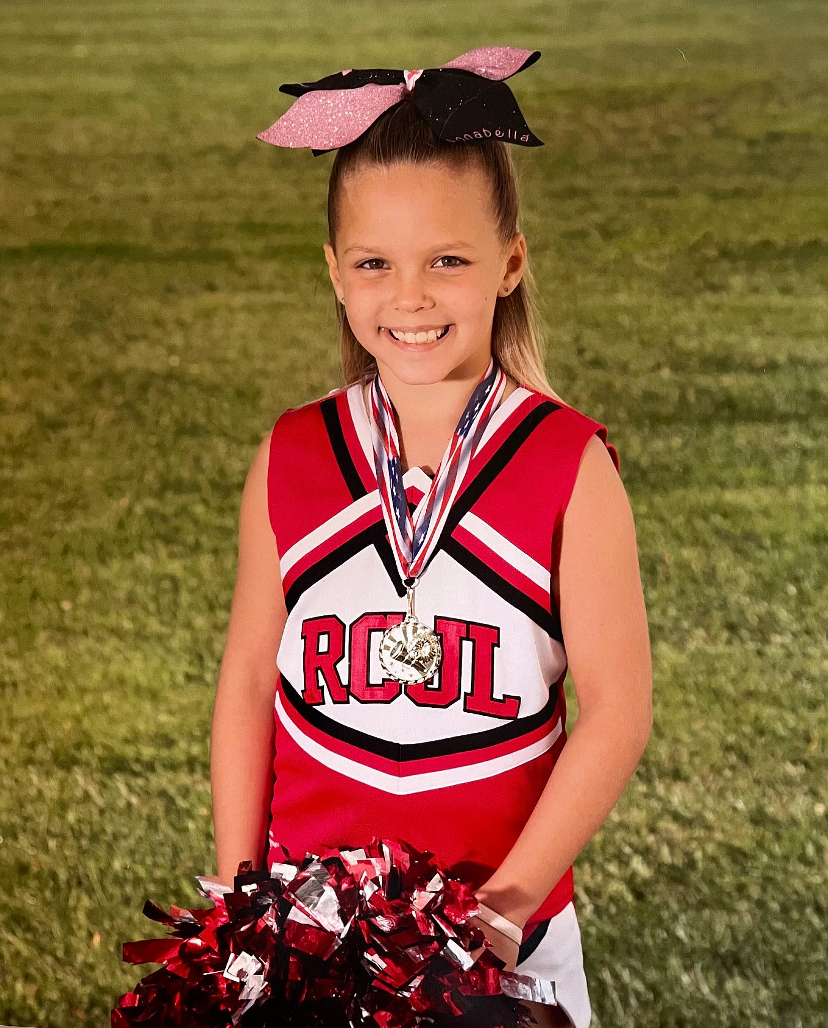 Annabella joined the competition — help win amazing prizes! championship, cheerleading_uniform, competition_event, eye, face, goggles, grass, hair, happy, head, jersey, joy, person, player, red, smile, sports, sports_uniform, sportswear, team_sport