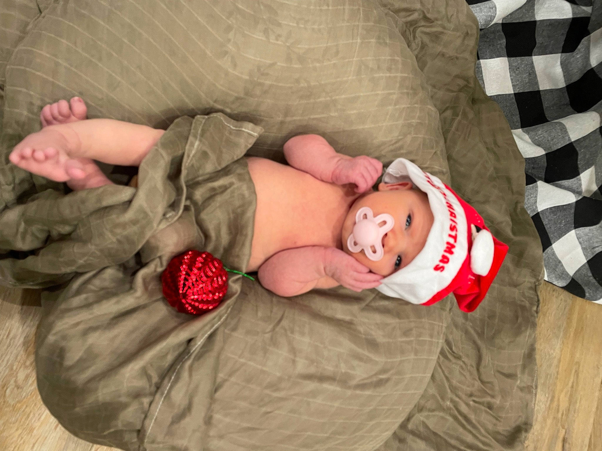 Mylah joined the competition — help win amazing prizes! baby, baby_sleeping, baby_toddler_clothing, bedtime, child, comfort, finger, flooring, headgear, headwear, human, leg, linens, pattern, people, person, room, sitting, skin, textile