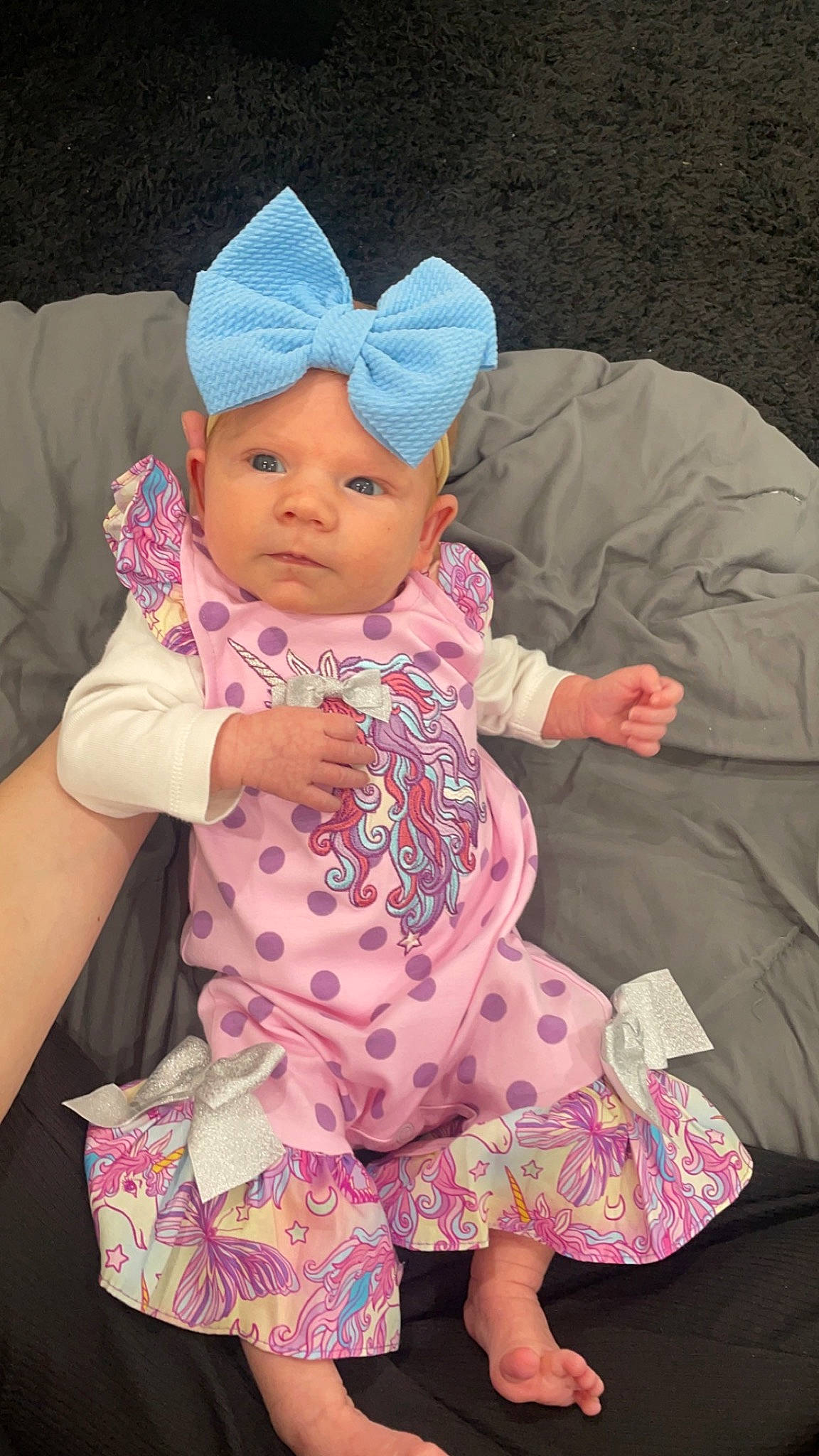 Mylah is registered to the contest to win money with this photo: baby, baby_products, baby_toddler_clothing, baseball_cap, cap, cheek, child, comfort, fashion_accessory, fun, headwear, human_body, magenta, person, pink, purple, sitting, skin, sleeve, textile