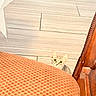 Luna joined the competition — help win amazing prizes! cat, kitten, animal, pet, wide_eyes, peeking, sitting, indoors, chair, upholstery, red, patterned_fabric, wooden_furniture, tile_floor, home, portrait, close_up, curious, whiskers, ears