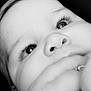 child, face, close_up, black_and_white, eyes, hand, portrait, expression, skin, nose, eyelashes, young, innocence, monochrome, detail, baby, person, cute, soft, intimate