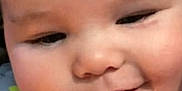 Liam is registered to the contest to win money with this photo: baby, smiling, close_up, infant, face, onesie, blue_clothing, star_pattern, fish_pattern, cute, child, young, happy, cheeks, skin, portrait, baby_face, expression, head, indoors