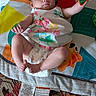 áine joined the competition — help win amazing prizes! baby, infant, play_mat, toy, mirror, floral_dress, diaper, carpet, floor, indoor, child, person, cute, small, face, legs, arms, hand, foot, colorful
