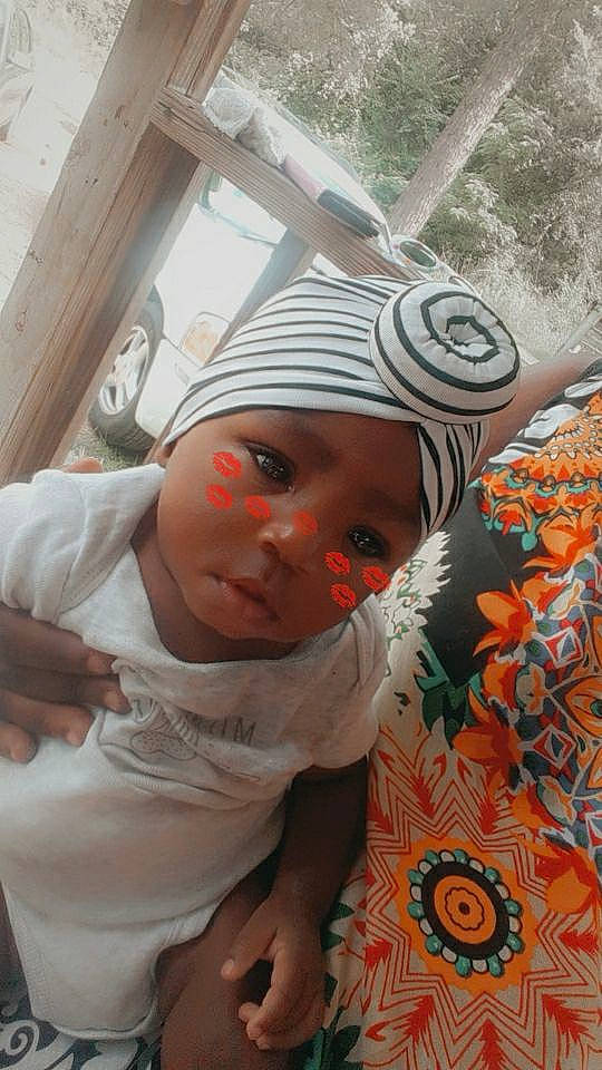 Noel is registered to the contest to win money with this photo: baby, child, headgear, headwear, person, toddler