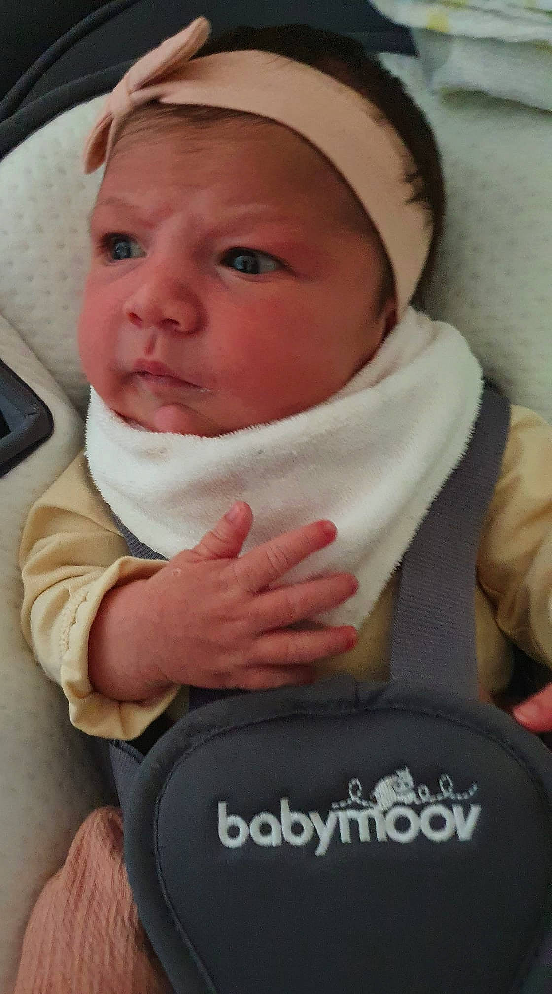 Abby participe au concours pour gagner de l'argent avec cette photo : baby, baby_toddler_clothing, cheek, comfort, eye, eyebrow, eyelash, face, finger, gesture, head, lip, mouth, nose, person, seat_belt, skin, sleeve, thumb, toddler