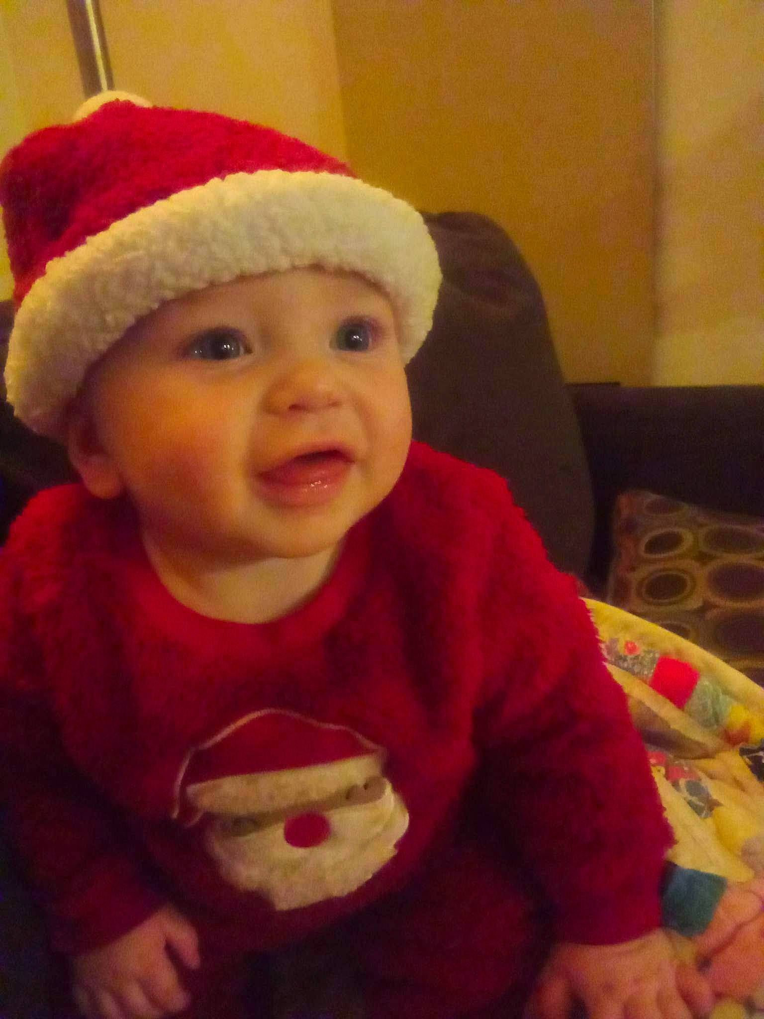 Cori is registered to the contest to win money with this photo: baby, baby_toddler_clothing, cap, cheek, clothing, cool, eye, face, facial_expression, happy, head, headwear, human_body, lip, mouth, nose, outerwear, person, skin, sleeve