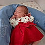 Iyana participe au concours pour gagner de l'argent avec cette photo : baby, newborn, sleeping, red_skirt, white_top, heart_pattern, cushion, blue_cushion, bed, blanket, indoor, infant, peaceful, cute, resting, child, person, soft_lighting, cozy, toddler