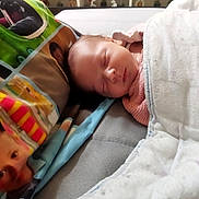 Iyana participe au concours pour gagner de l'argent avec cette photo : baby, sleeping, blanket, pillow, bed, infant, cozy, resting, face, portrait, indoors, child, cute, peaceful, soft, newborn, clothing, comfort, closeup, home