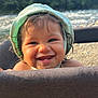toddler, child, smiling, face, curly_hair, bonnet, playpen, outdoor, nature, trees, water, baby, happy, portrait, skin, headwear, cute, sunlight, daylight, closeup