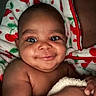 Darius Jr joined the competition — help win amazing prizes! baby, blanket, cherry_pattern, child, closeup, cuddly, cute, expression, eyes, face, hand, happy, indoors, infant, person, portrait, skin, smile, soft, warm