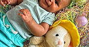 Darius Jr is registered to the contest to win money with this photo: baby, celebration, child, clothing, colorful, cute, easter_eggs, happy, holiday, indoors, lying_down, pastel_colors, plush_bunny, portrait, shredded_paper, smiling, soft_toys, spring, yellow_boots, yellow_hat