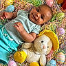 baby, celebration, child, clothing, colorful, cute, easter_eggs, happy, holiday, indoors, lying_down, pastel_colors, plush_bunny, portrait, shredded_paper, smiling, soft_toys, spring, yellow_boots, yellow_hat