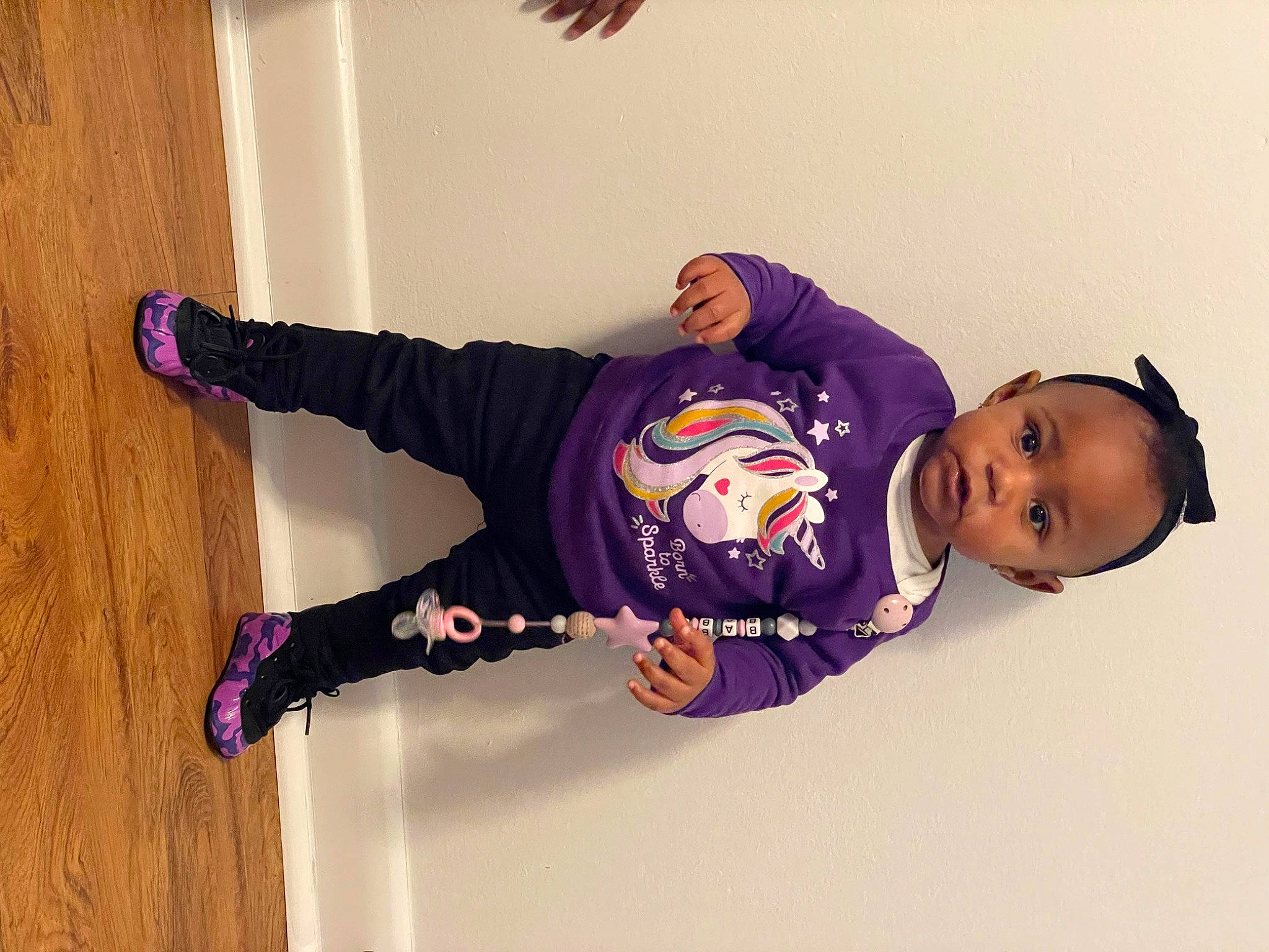 Skylah joined the competition — help win amazing prizes! baby_toddler_clothing, child, electric_blue, flooring, font, fun, happy, hardwood, knee, outerwear, person, purple, sitting, sleeve, smile, sock, sportswear, thigh, toddler