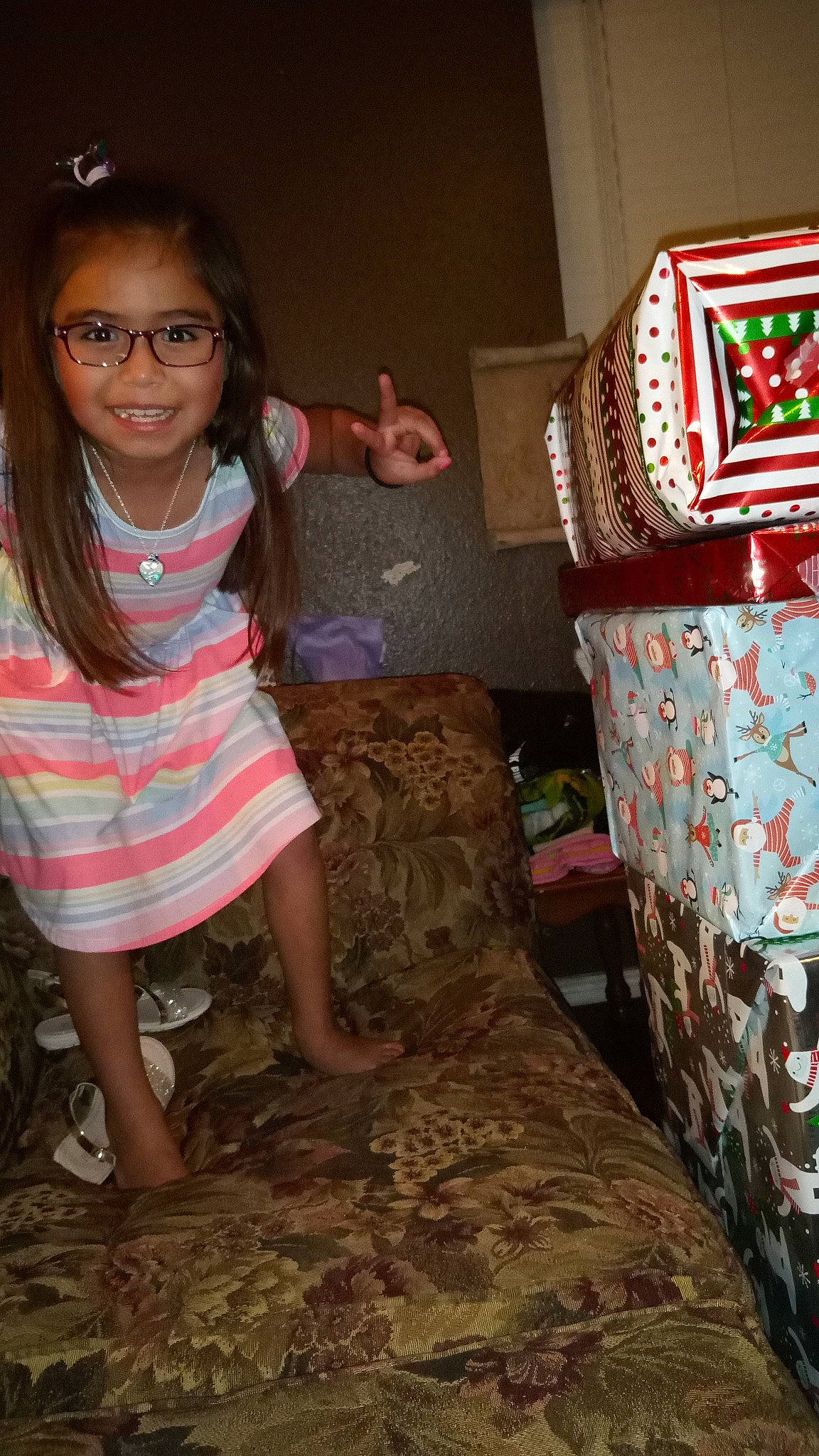 Aliyanna joined the competition — help win amazing prizes! beauty, carpet, eye, eyewear, face, flooring, foot, fun, head, human_leg, joy, linens, pattern, person, room, sandal, sitting, smile, textile, thigh