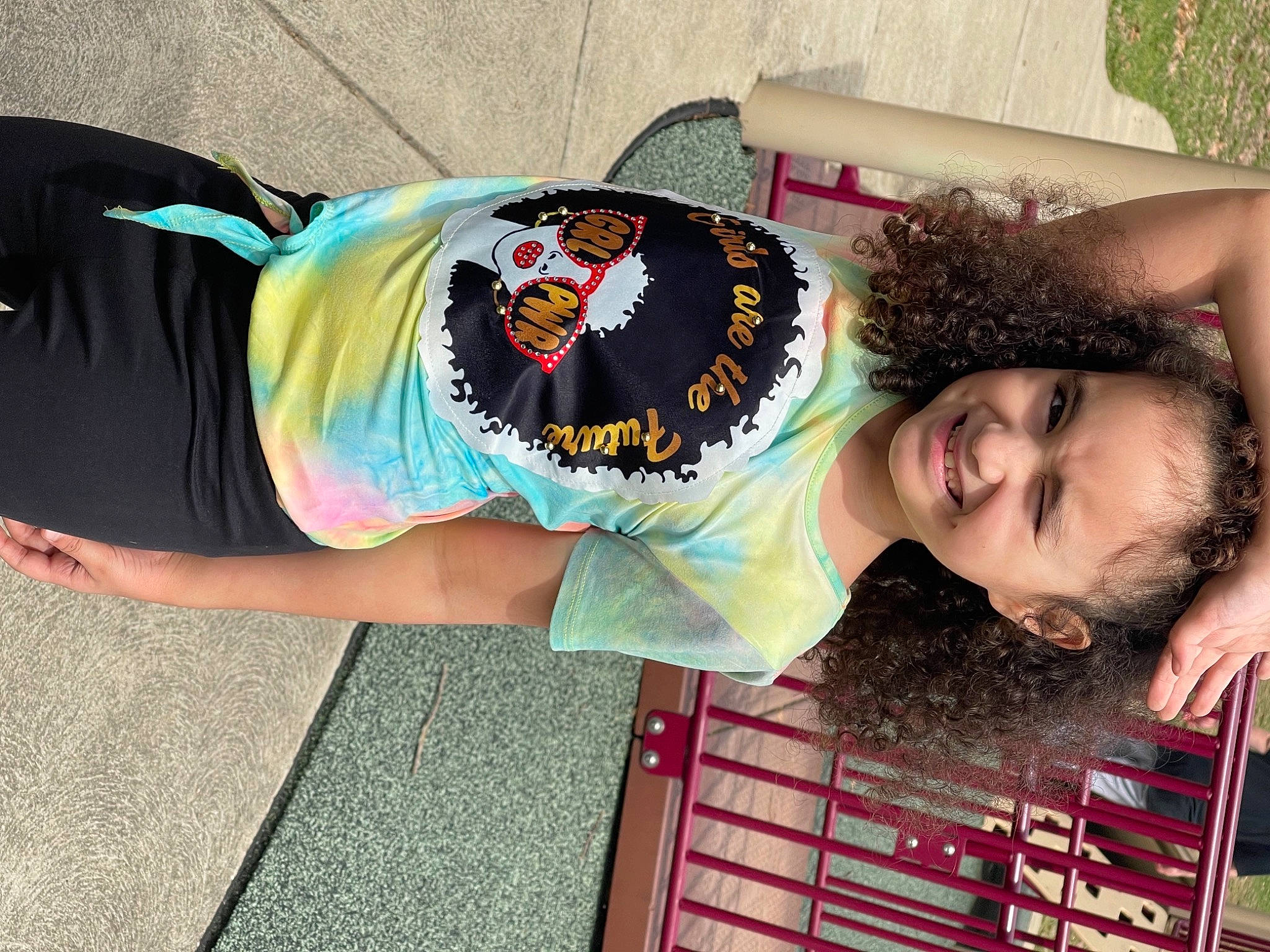 Emma is registered to the contest to win money with this photo: black_hair, child, costume, eyelash, eyewear, fashion_accessory, fun, grass, happy, jewellery, joy, leisure, magenta, pattern, person, pink, street_fashion, sunglasses, t_shirt, textile