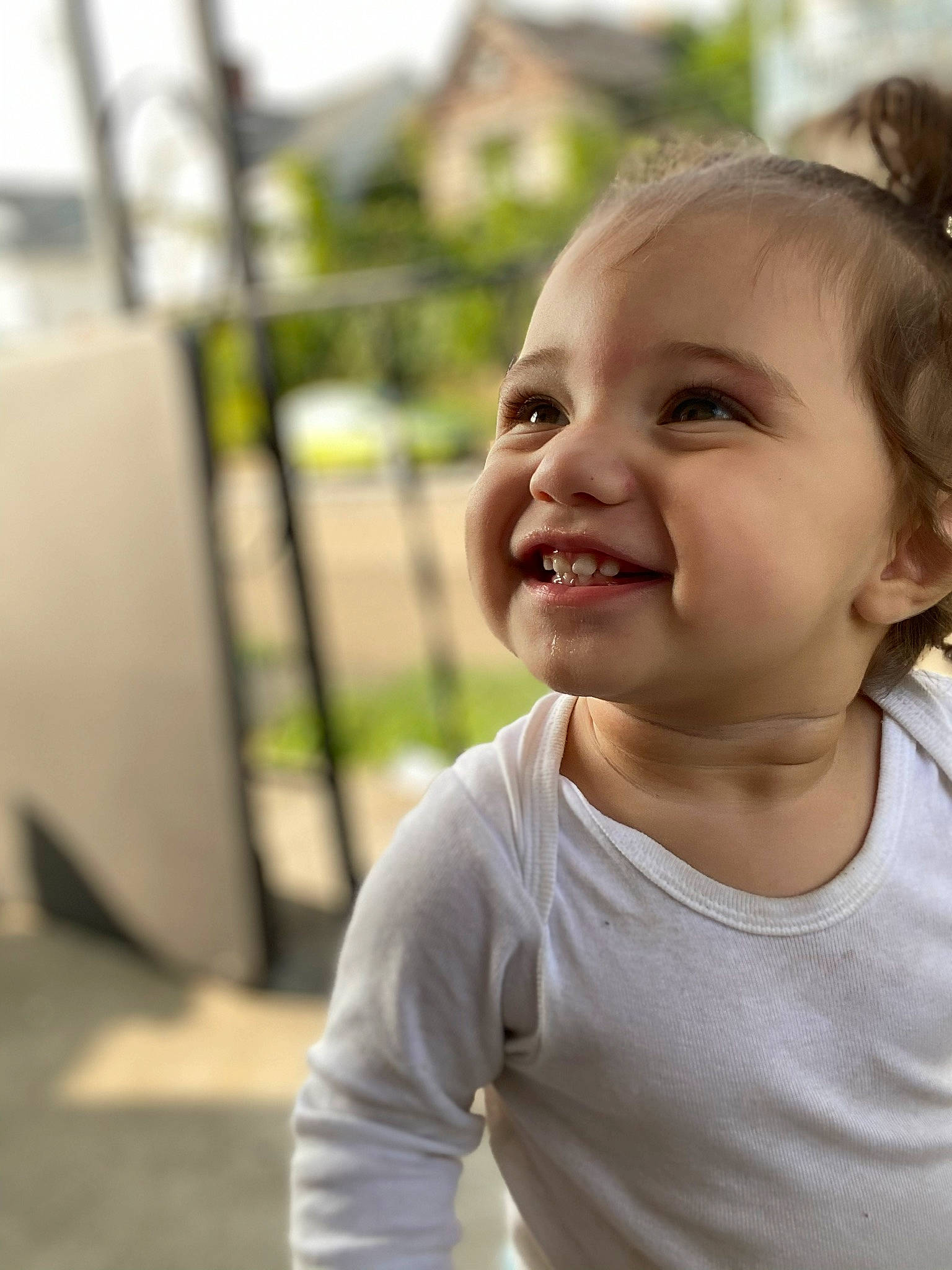 Evalyn joined the competition — help win amazing prizes! baby, blond, eye, fun, grass, happy, human_body, iris, joy, leisure, lip, mouth, nose, people_in_nature, person, plant, sitting, skin, smile, t_shirt