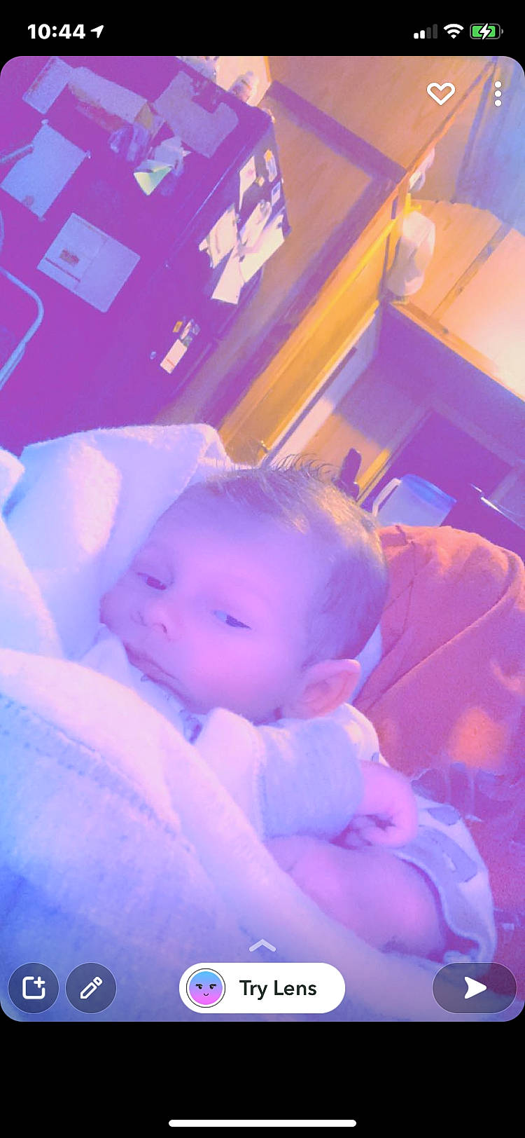 Chase is registered to the contest to win money with this photo: baby, baby_toddler_clothing, ceiling, child, electric_blue, fun, hat, lighting, magenta, orange, person, petal, pink, purple, room, sitting, thumb, toddler, violet