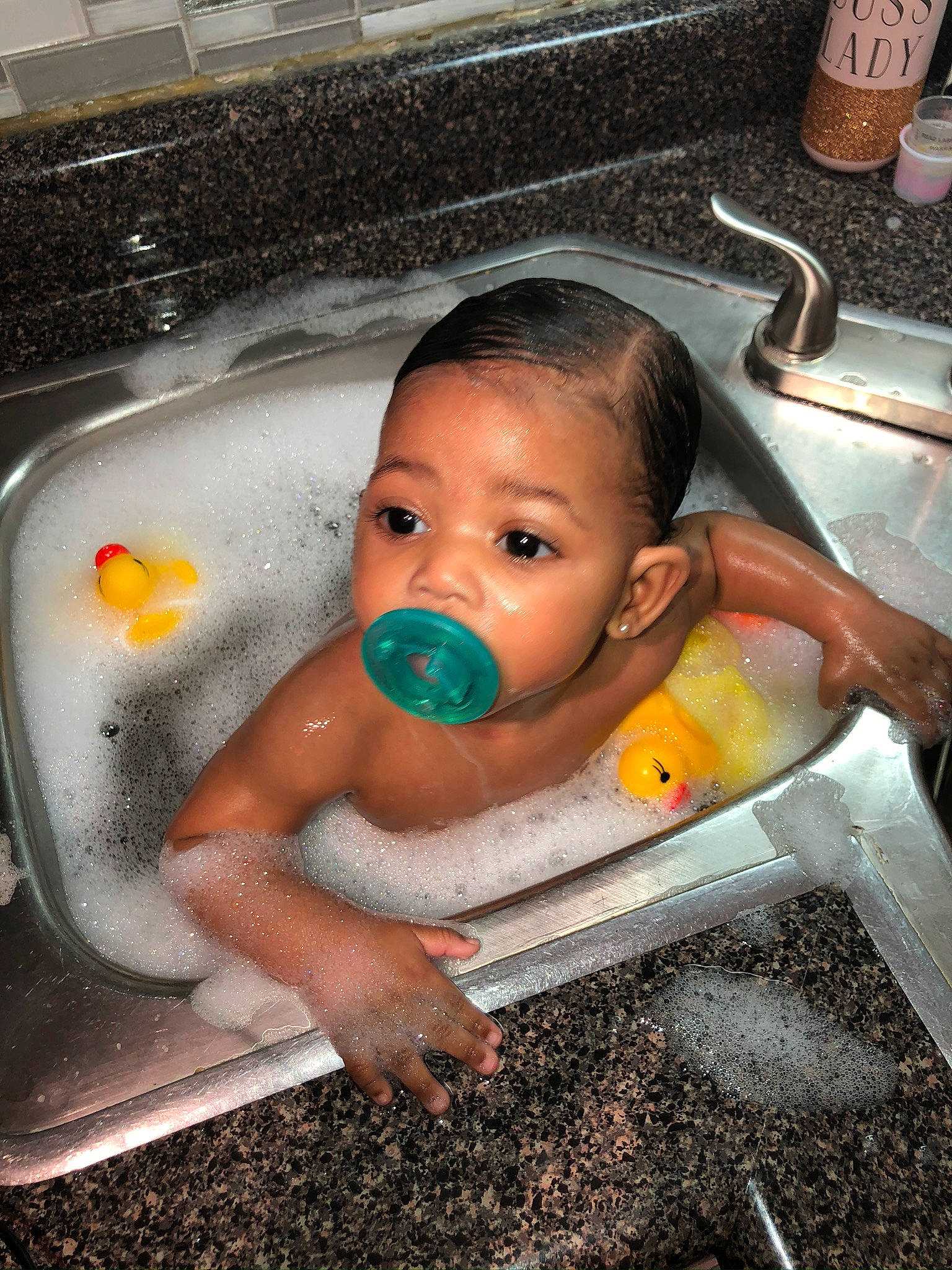 Caloni is registered to the contest to win money with this photo: baby, baby_bathing, bathing, bathtub, child, comfort_food, fun, person, plumbing_fixture, surprise, toddler, washing
