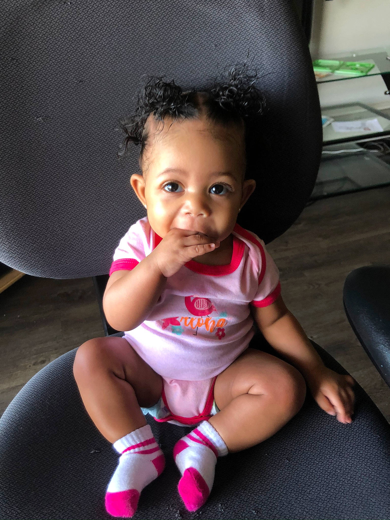 Caloni is registered to the contest to win money with this photo: baby, beauty, black_hair, cheek, child, head, lip, person, pink, sitting, skin, smile, toddler