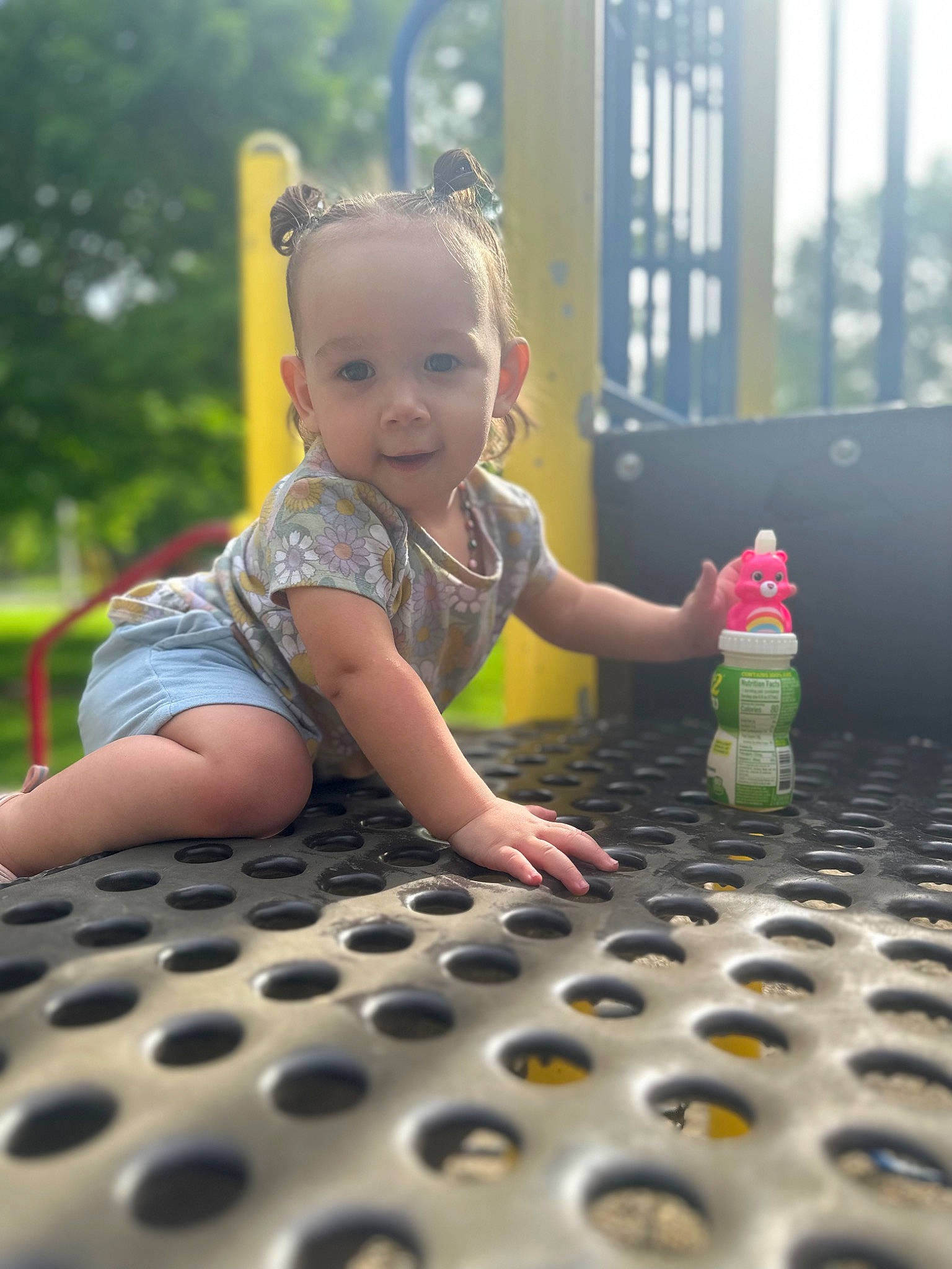 Khaleesi is registered to the contest to win money with this photo: baby, baby_toddler_clothing, facial_expression, finger, hairstyle, hand, happy, human, human_body, leaf, light, organ, person, pink, plant, product, skin, smile, standing, sunlight