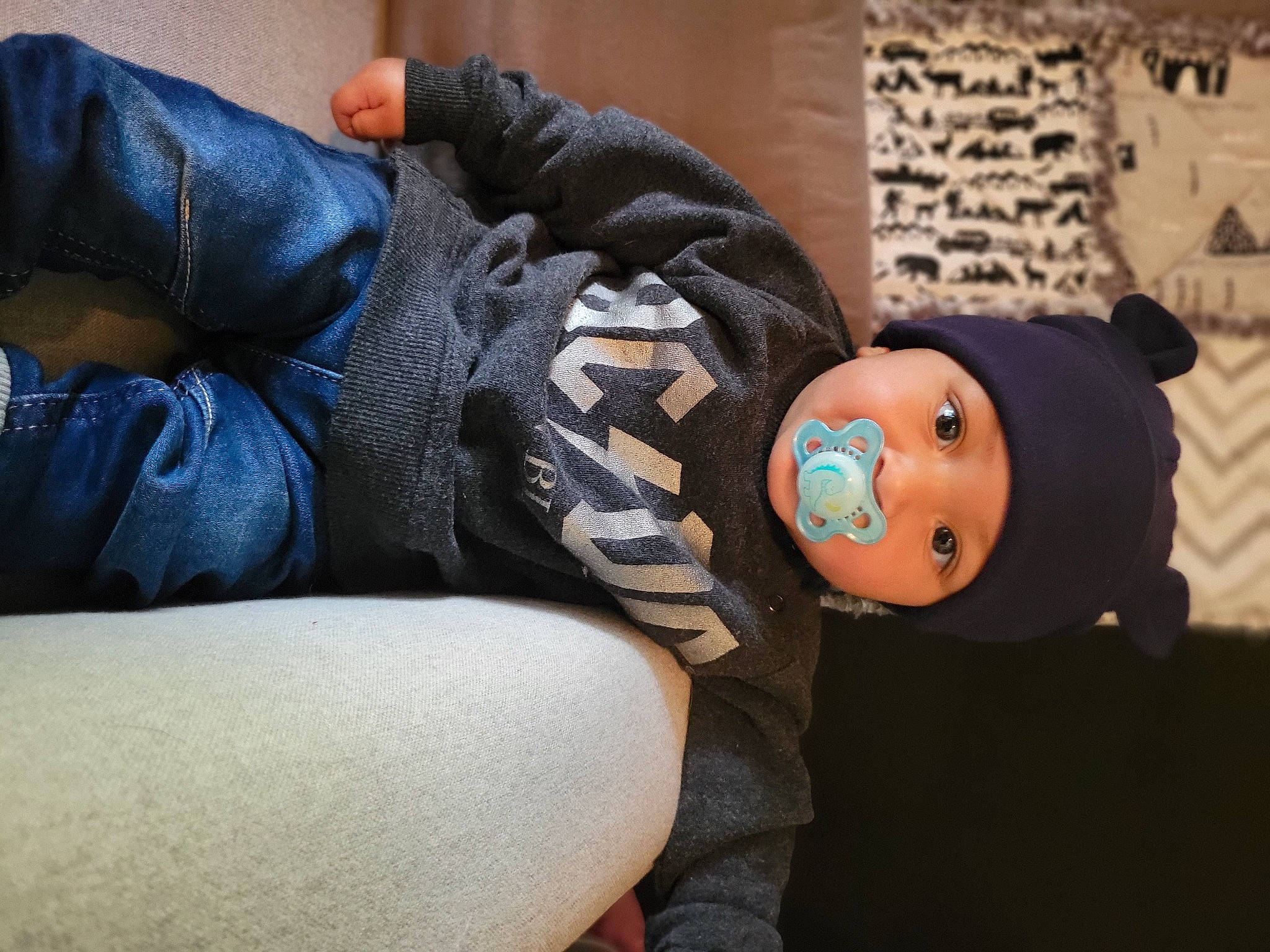 Jalen is registered to the contest to win money with this photo: abdomen, comfort, denim, elbow, electric_blue, gesture, hat, headgear, headwear, human_leg, knee, person, sitting, textile, thigh, waist, wrist