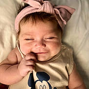Amanda joined the competition — help win amazing prizes! adorable, baby, baby_fashion, child, chubby_cheeks, closeup, clothing, cute, hand, headband, indoors, infant, mickey_mouse, person, pink, portrait, sleepy_eyes, smile, soft_background, tank_top