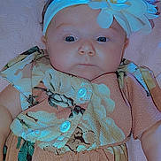Paisley joined the competition — help win amazing prizes! baby, infant, flower_headband, dress, floral_pattern, blanket, soft_texture, cute, child, portrait, laying_down, pink, fabric, buttoned_dress, small_hand, skin, face, eyes, head, clothing