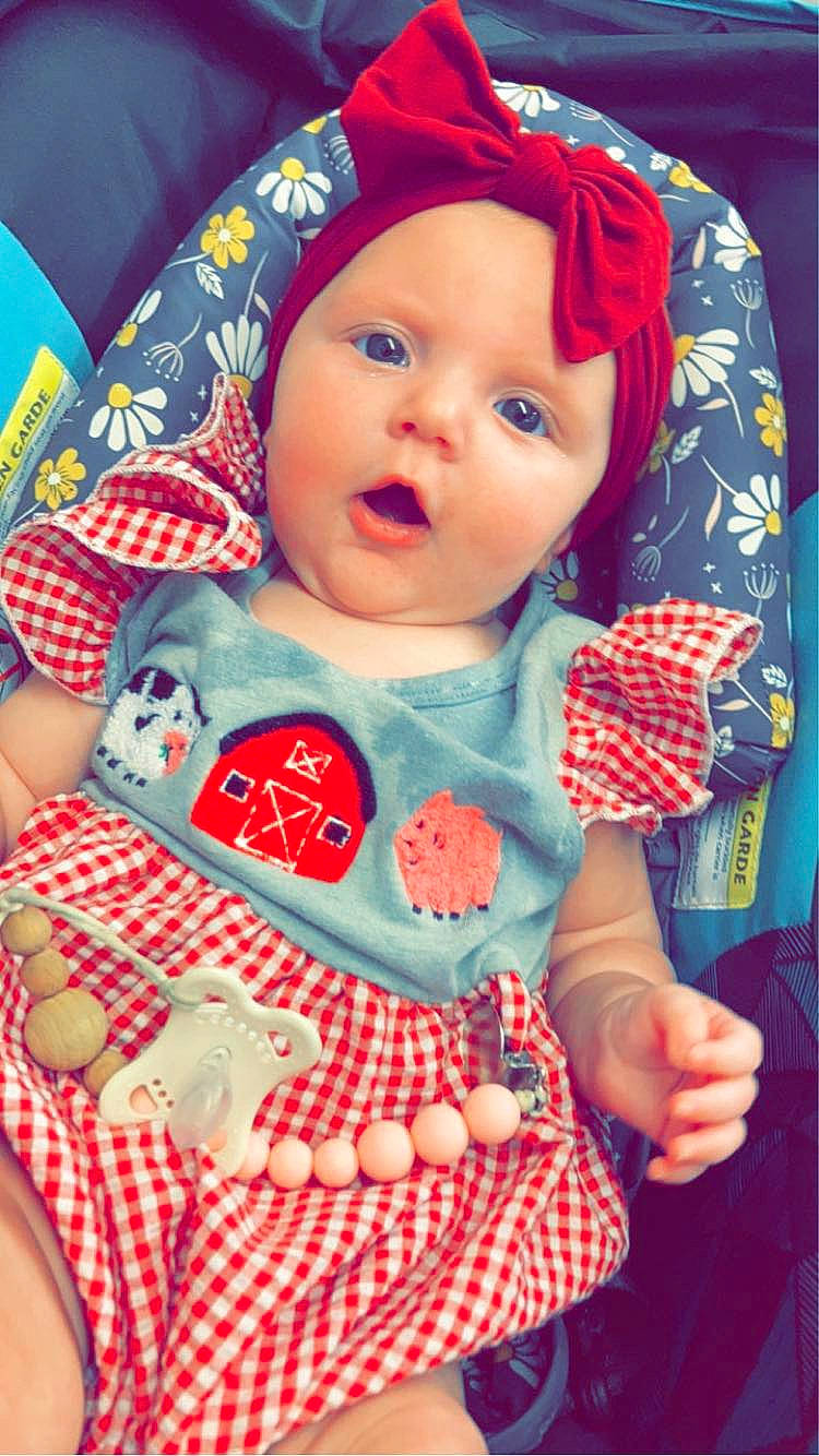 Sadie Mae joined the competition — help win amazing prizes! baby, baby_products, baby_toddler_clothing, blue, cap, cheek, child, comfort, electric_blue, fun, happy, headwear, linens, pattern, person, plaid, play, red, sitting, sleeve