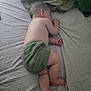 Ezio Jegu participe au concours pour gagner de l'argent avec cette photo : baby, sleeping, bed, pillow, blanket, infant, child, patterned_sheet, green_shorts, skin, foot, hand, head, ear, sleep, rest, indoors, cozy, cute, peaceful
