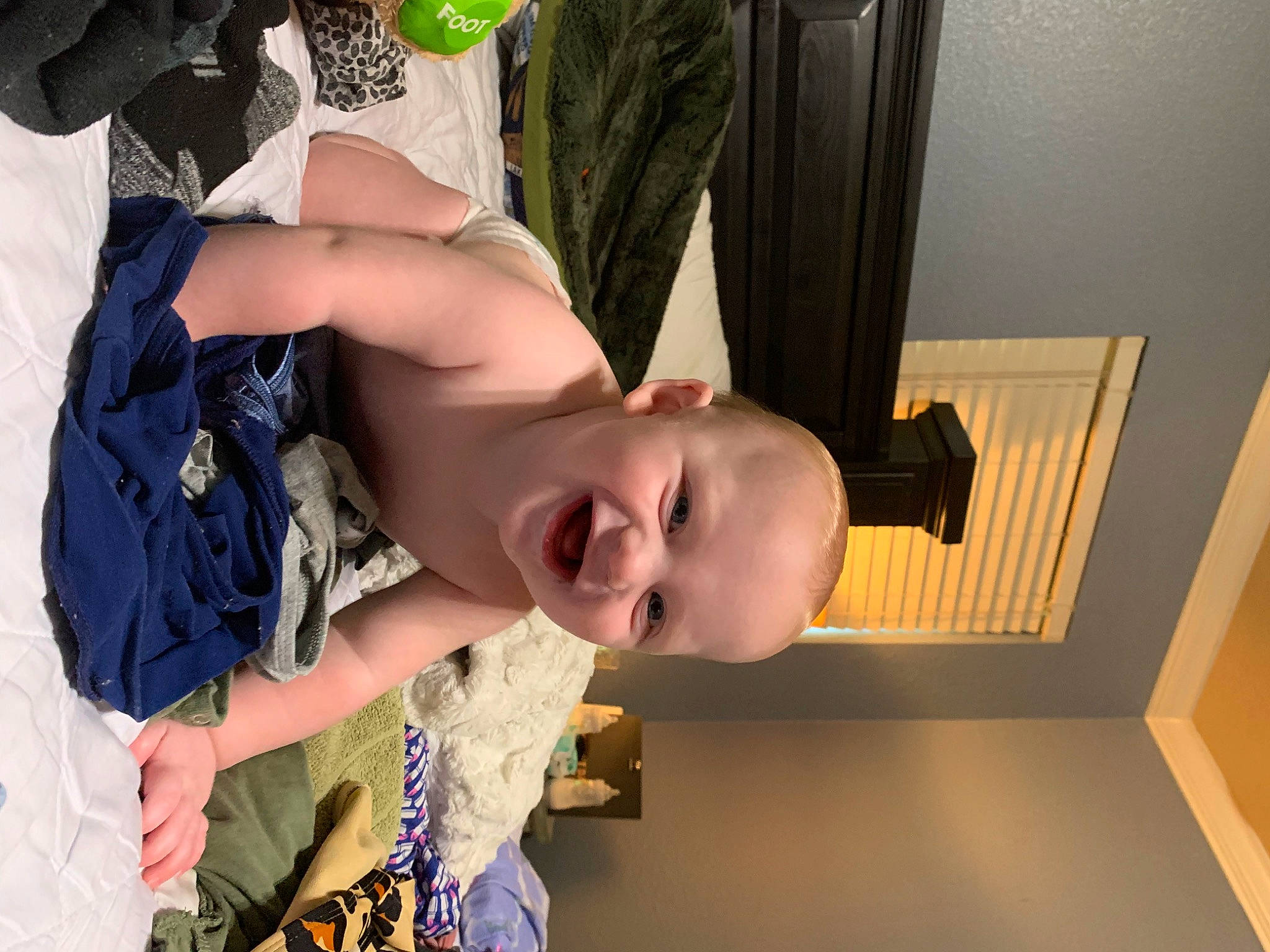 Easton is registered to the contest to win money with this photo: baby, baby_products, baby_toddler_clothing, chest, child, flooring, fun, glasses, hairstyle, happy, house, human_body, joint, leg, mouth, person, smile, sunglasses, toddler, tree