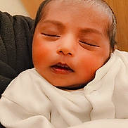 Prisha joined the competition — help win amazing prizes! baby, child, closeup, cute, face, head, human, indoor, infant, newborn, peaceful, person, portrait, resting, skin, sleeping, soft_lighting, toddler, warm, white_clothing