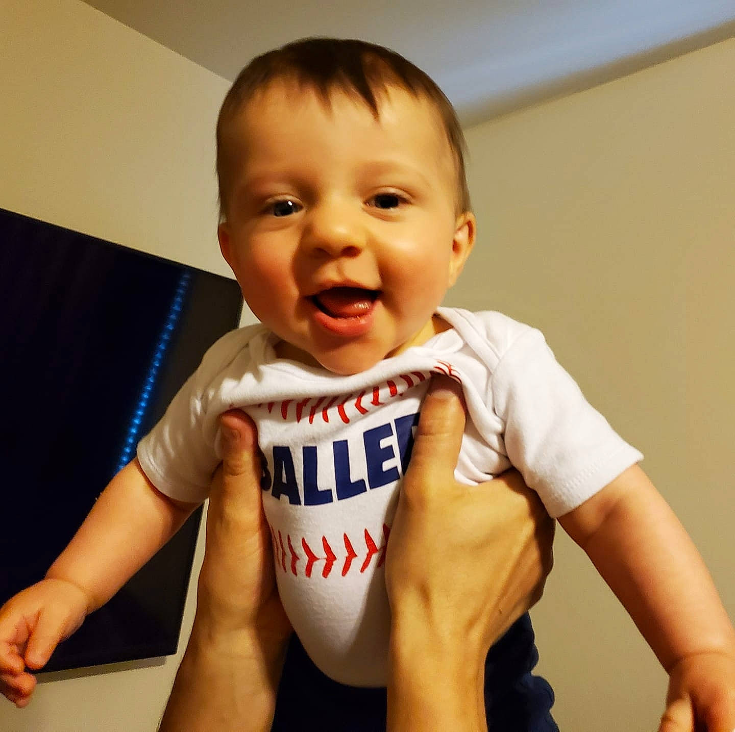 Coleson is registered to the contest to win money with this photo: arm, baby, baby_toddler_clothing, child, cool, facial_expression, finger, food, hand, happy, junk_food, muscle, person, sleeve, smile, t_shirt, toddler