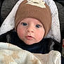 baby, infant, hat, blanket, blue_eyes, face, clothing, cute, cozy, warm, child, portrait, indoors, person, headwear, newborn, soft, expression, bundle, closeup