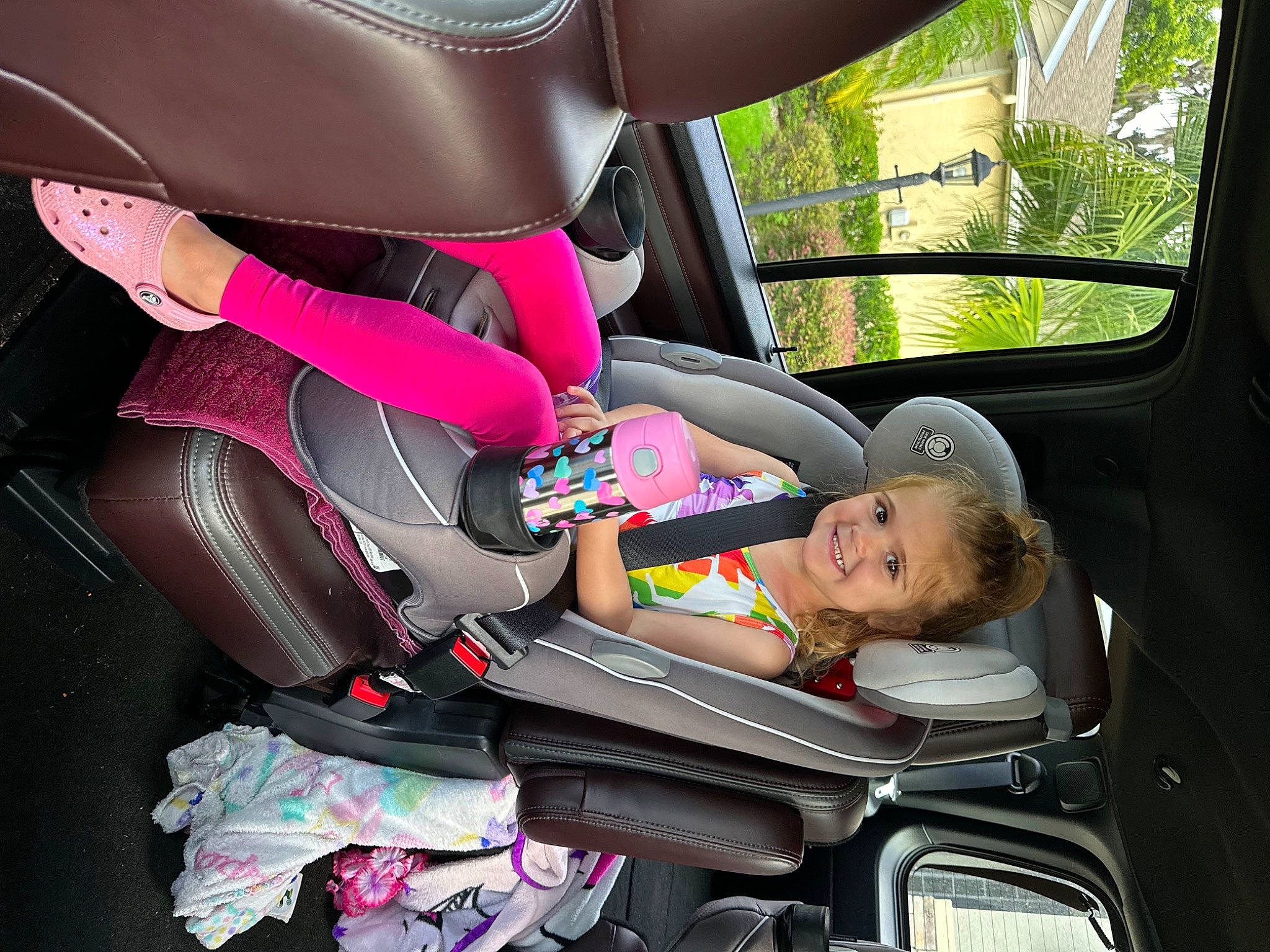 Everleigh is registered to the contest to win money with this photo: auto_part, automotive_design, automotive_exterior, car, car_seat, car_seat_cover, comfort, family_car, head_restraint, joy, mode_of_transport, motor_vehicle, person, plant, seat_belt, steering_part, steering_wheel, toddler, vehicle, vehicle_door