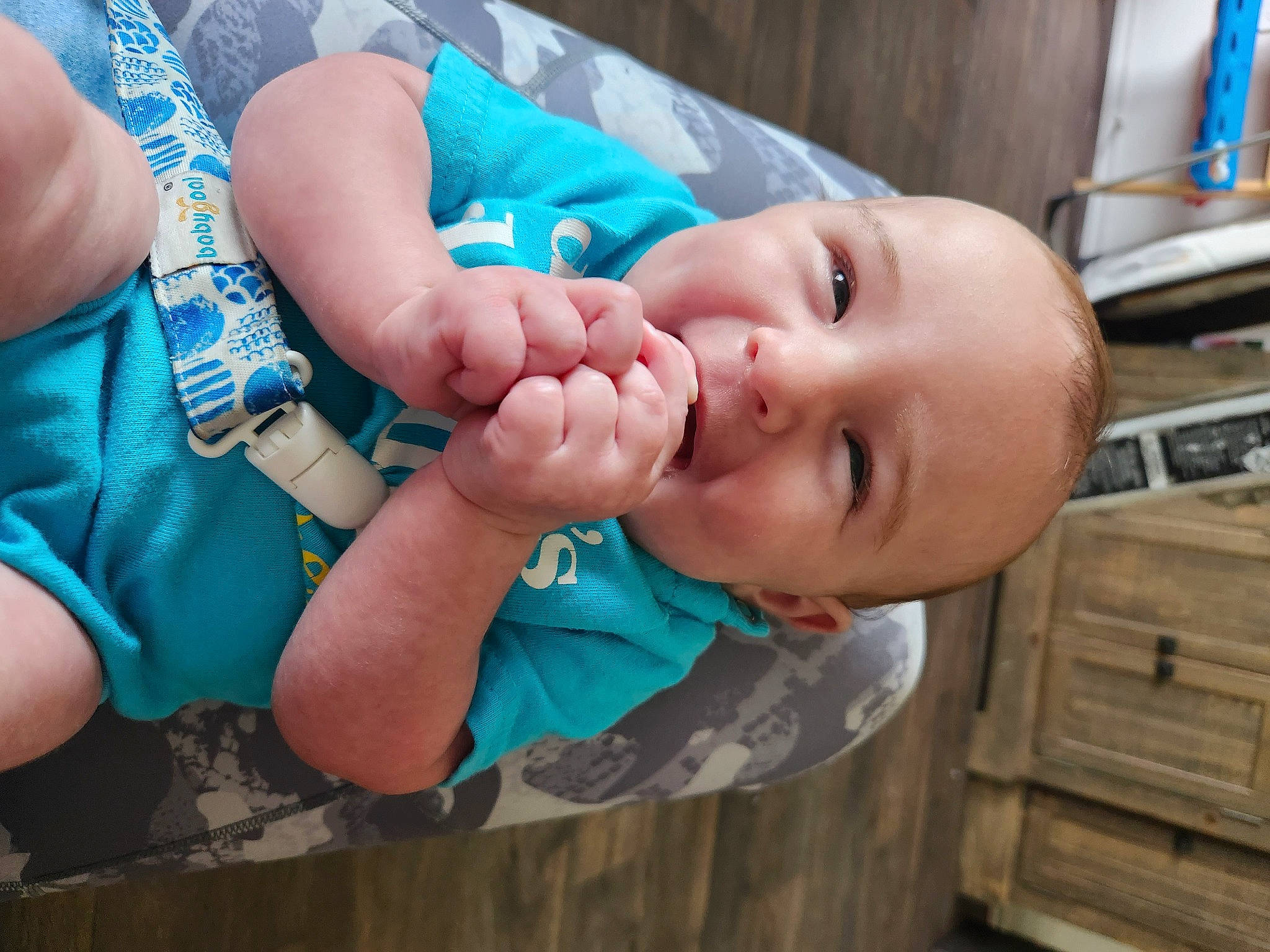 Clayton joined the competition — help win amazing prizes! arm, baby, baby_toddler_clothing, blue, cheek, child, finger, gesture, hand, happy, human_body, mouth, nail, nose, person, skin, smile, thumb, toddler, wood