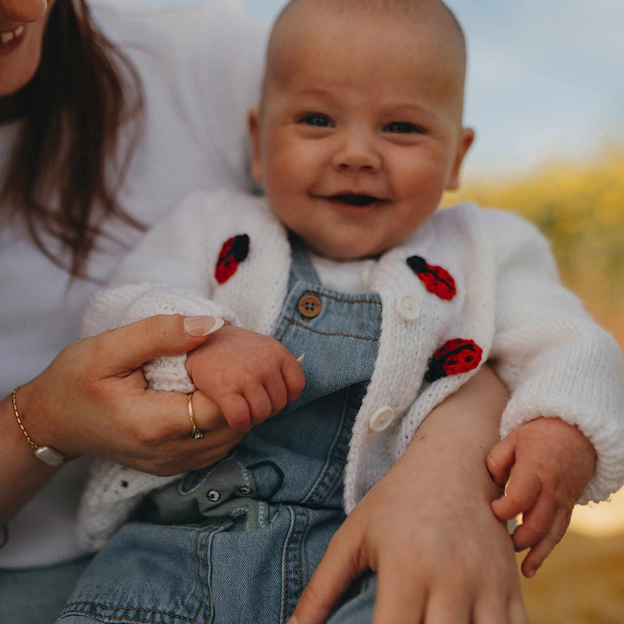 Ren joined the competition — help win amazing prizes! accessories, baby, bodypart, clothing, face, finger, hand, happy, head, jeans, jewelry, knitwear, newborn, pants, person, photography, portrait, ring, smile, sweater