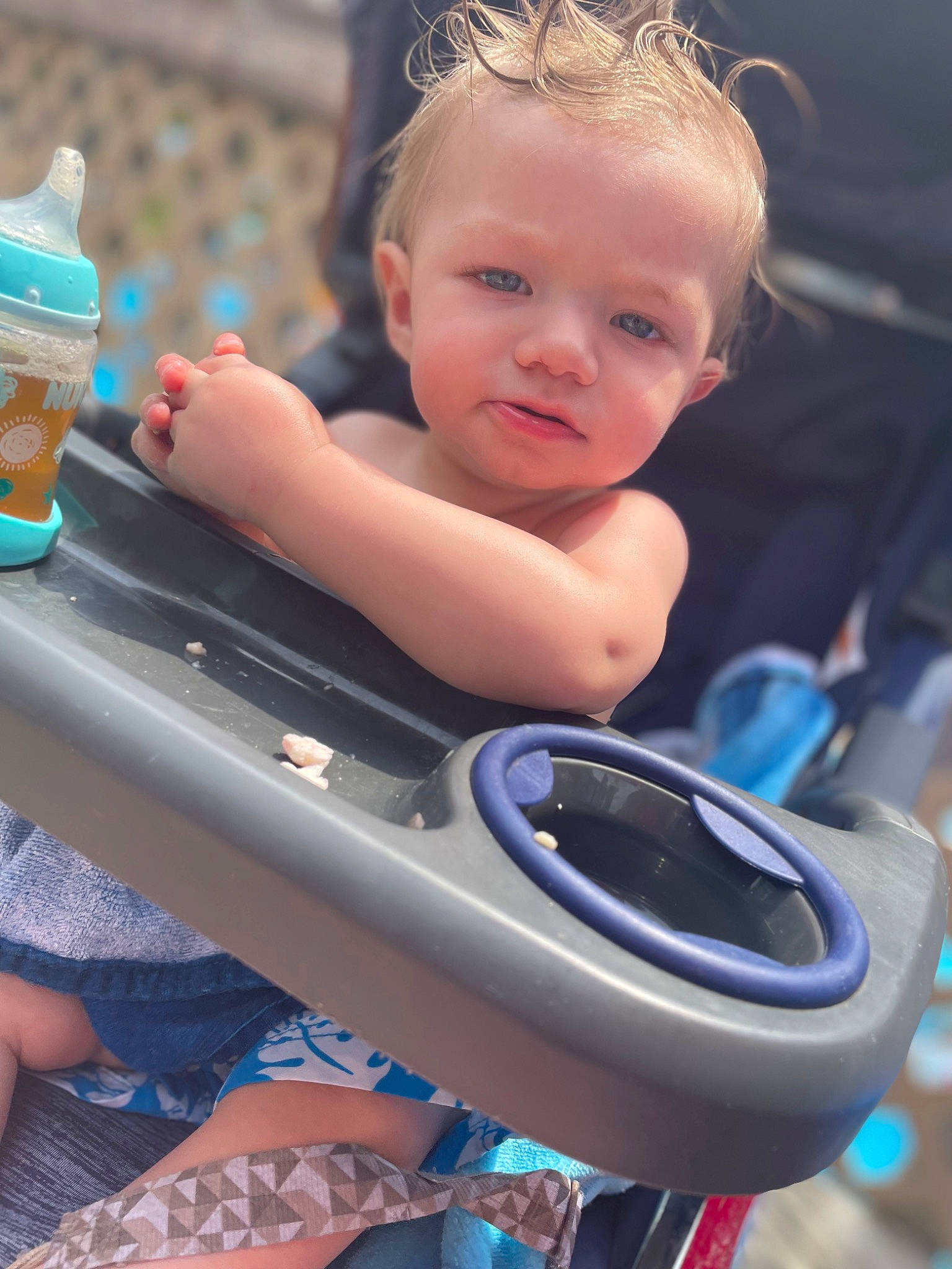 Cameron is registered to the contest to win money with this photo: automotive_tire, baby, baby_products, baby_toddler_clothing, blue, child, electric_blue, fun, hairstyle, happy, leisure, person, plastic_bottle, product, recreation, rim, sitting, skin, summer, toddler