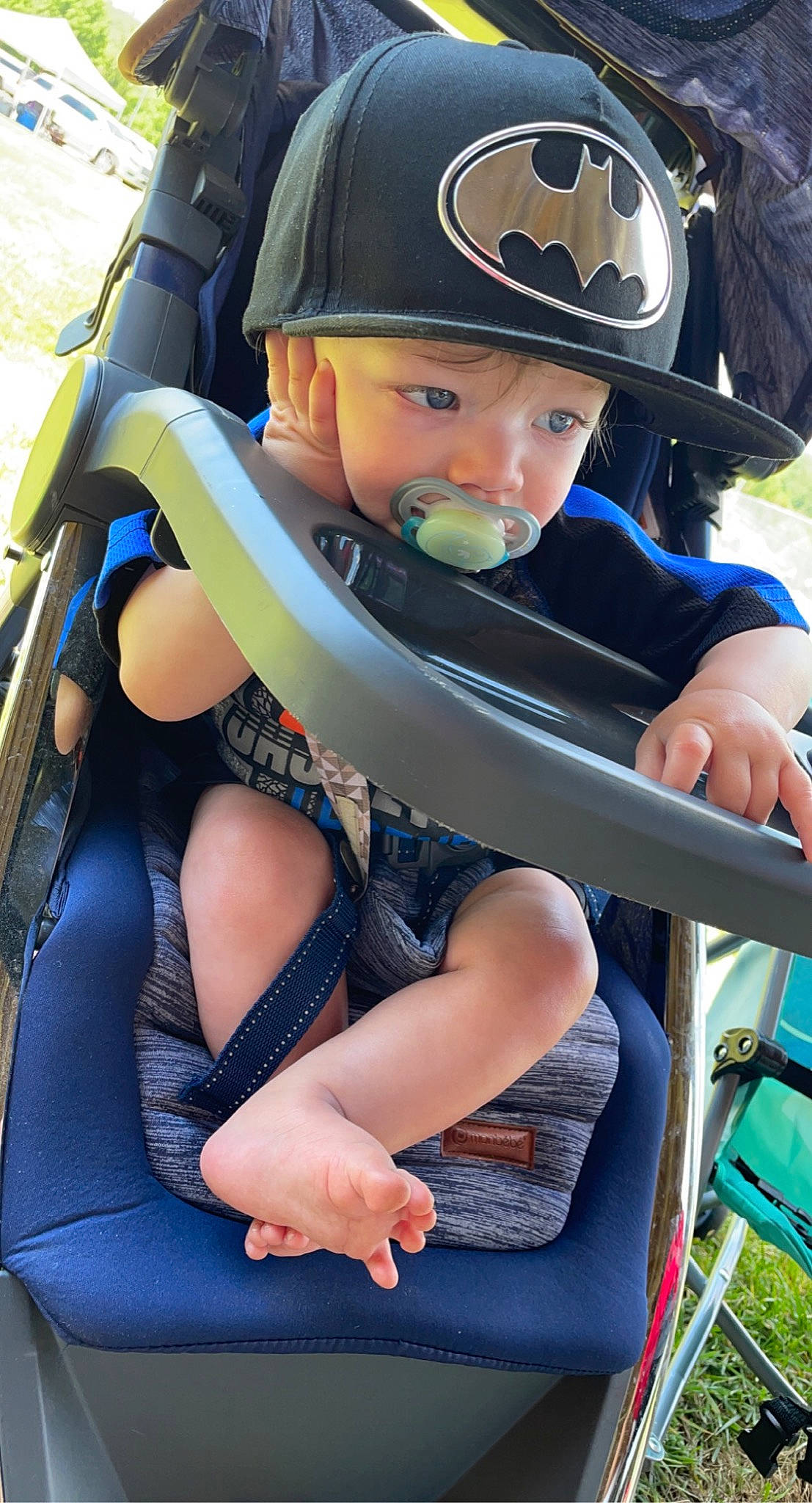 Cameron joined the competition — help win amazing prizes! baby_carriage, baby_products, blue, cap, chair, child, comfort, electric_blue, fun, green, hat, headgear, headwear, helmet, human_leg, lap, leisure, person, personal_protective_equipment, recreation