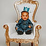 baby, child, smiling, denim_outfit, crown, chair, throne, ornate, white, gold, portrait, happy, cute, indoor, seated, young_child, fashion, studio, one_half, celebration